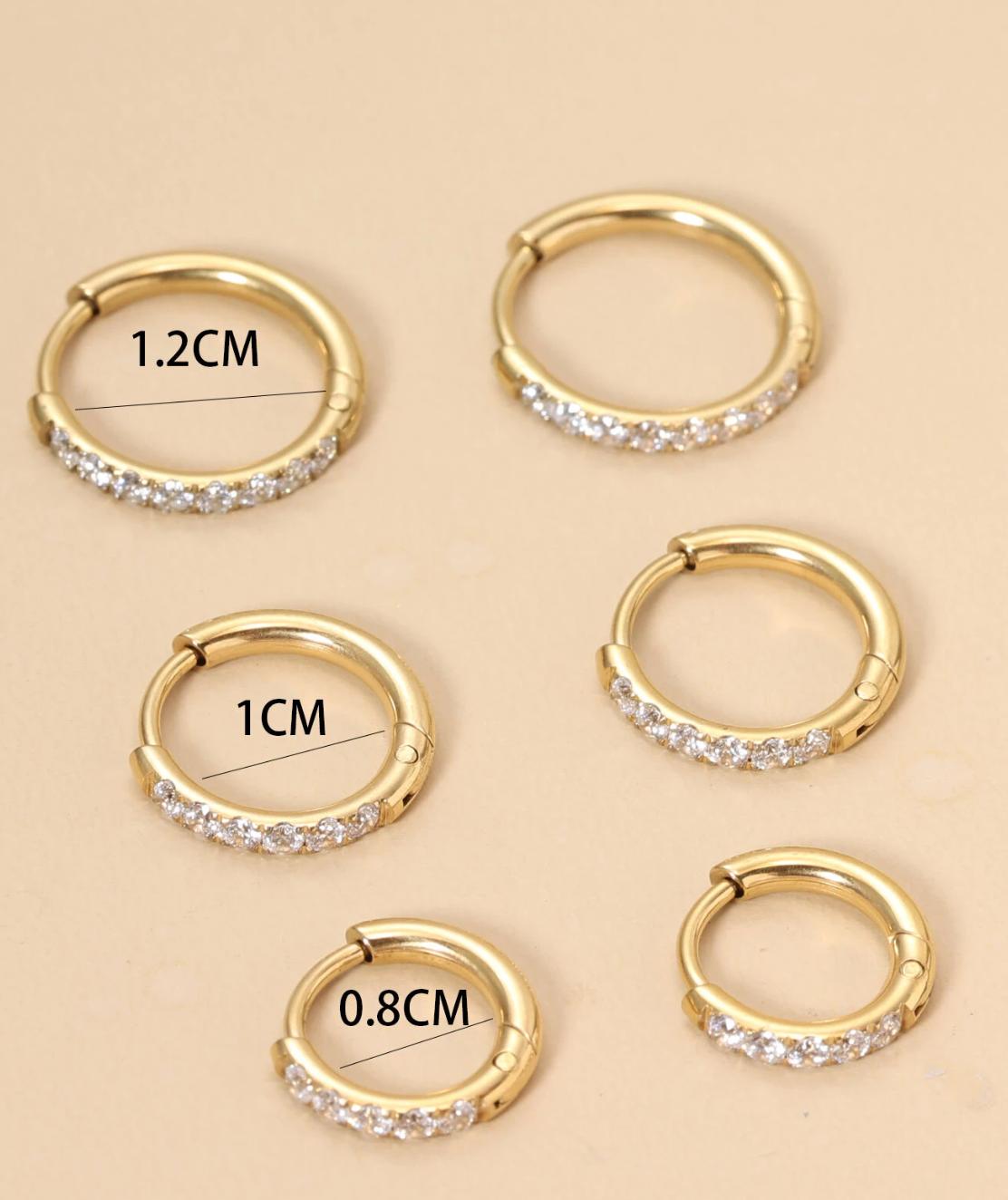 Huggies - A pair of stainless steel gold  earrings