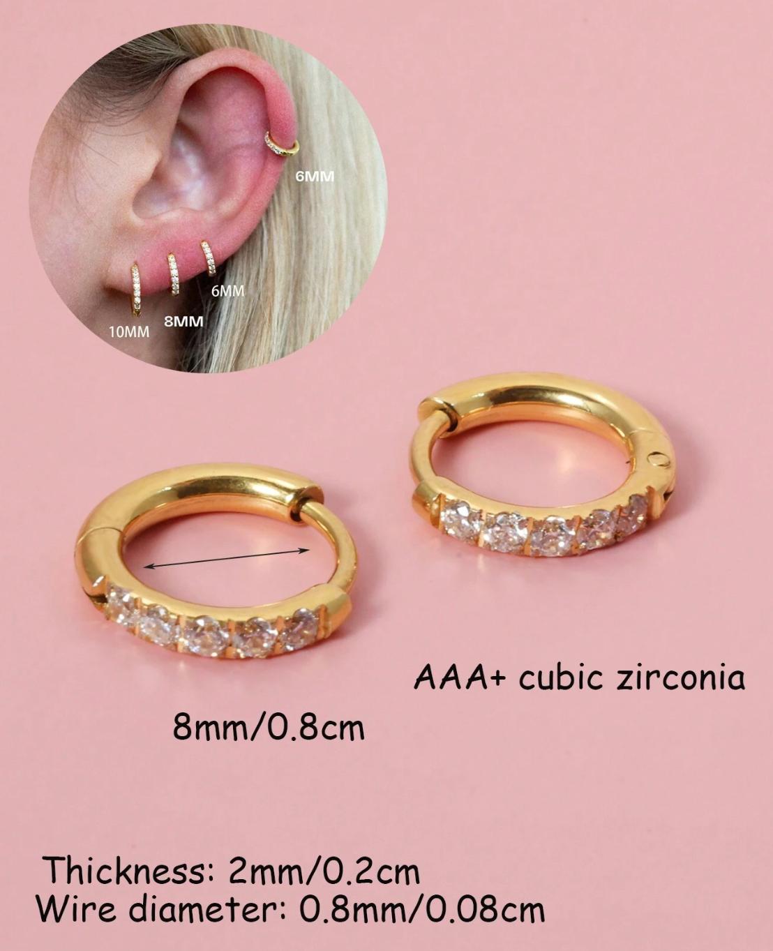 Huggies - A pair of stainless steel gold  earrings