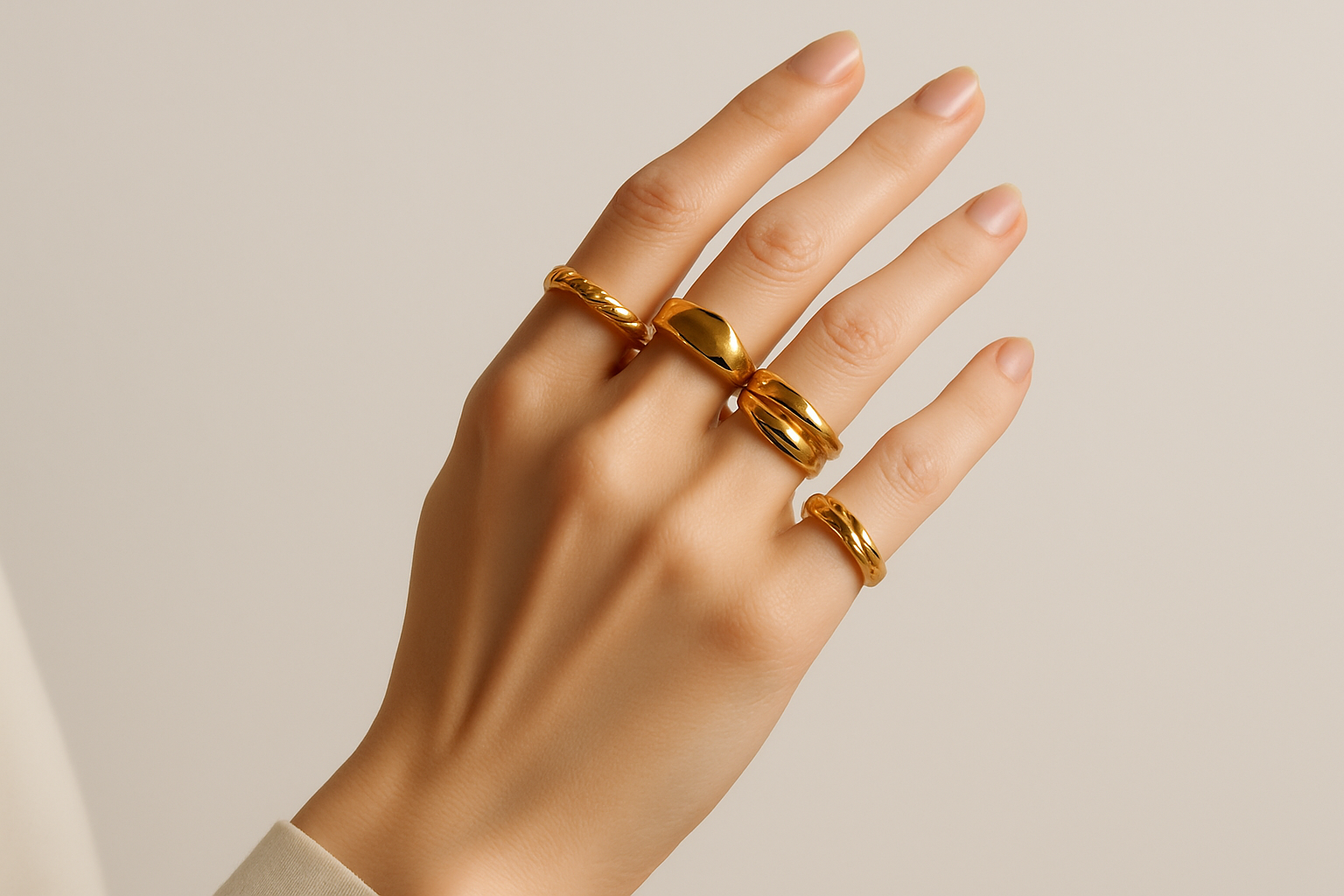 Female hand with a few stylish golden rings for a jewellery shop hero slider website